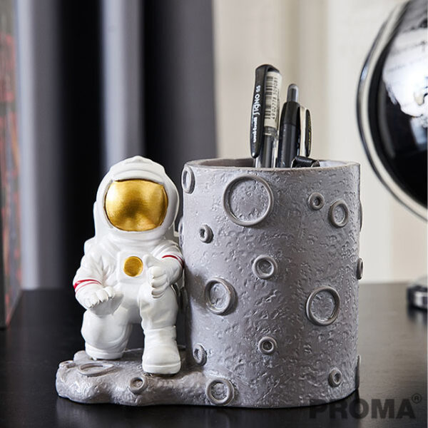Astronaut and Moon An astronaut stationery mug on the moon